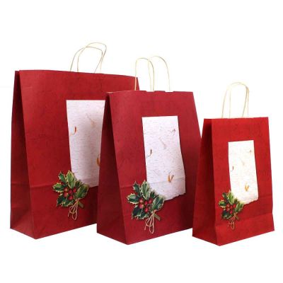 Shopper buste in carta natalizie Holly rosso con manici ritorti